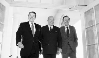 Secretary of State George Shultz, center, walks with President Ronald Reagan and Vice President George Bush upon his arrival at the White House in Washington, after two days of arms talks with the Soviet Union in Geneva. Shultz, former President Reagan&#39;s longtime secretary of state, who spent most of the 1980s trying to improve relations with the Soviet Union and forging a course for peace in the Middle East, died Saturday, Feb. 6, 2021. He was 100. (AP Photo/Barry Thumma, File)