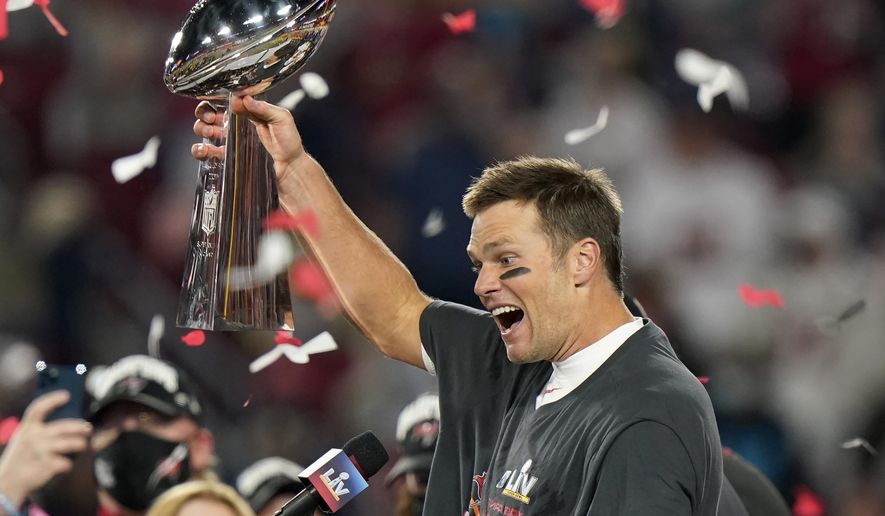 Tampa Bay Buccaneers quarterback Tom Brady celebrates with the Vince Lombardi Trophy after the NFL Super Bowl 55 football game against the Kansas City Chiefs Sunday, Feb. 7, 2021, in Tampa, Fla. The Buccaneers defeated the Chiefs 31-9 to win the Super Bowl. (AP Photo/Lynne Sladky)