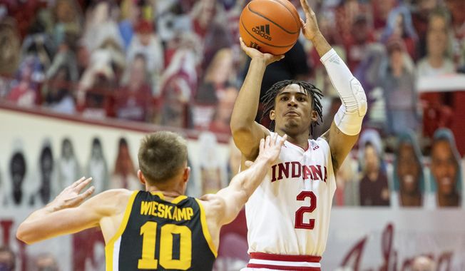 Indiana guard Armaan Franklin (2) shoots the winning basket during the second half of an NCAA college basketball game against Iowa, Sunday, Feb. 7, 2021, in Bloomington, Ind. (AP Photo/Doug McSchooler)