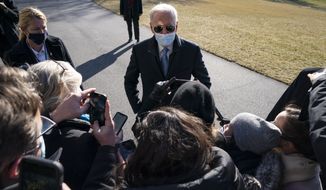 President Joe Biden talks with reporters after arriving on the South Lawn of the White House, Monday, Feb. 8, 2021, in Washington. (AP Photo/Evan Vucci)
