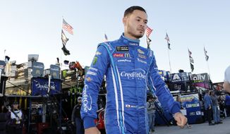 In this Oct. 18, 2019, file photo, Kyle Larson walks to the garage before the final practice for a NASCAR Cup Series auto race at Kansas Speedway in Kansas City, Kan. Kyle Larson was banished from NASCAR for all but the first month of his last season, his punishment for using a racial slur while racing online. Rick Hendrick felt the driver paid his penalty and deserved a second chance, one that begins with the season-opening Daytona 500. (AP Photo/Colin E. Braley, File) **FILE**