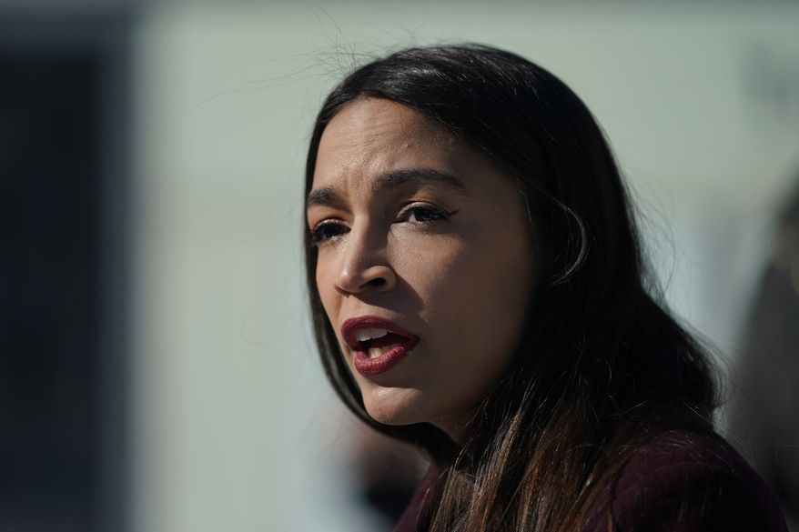 Rep. Alexandria Ocasio-Cortez speaks during a news conference in the Queens borough of New York, Monday, Feb. 8, 2021. Ocasio-Cortez was talking about a federal program that will help families pay for funeral costs during the economic downturn caused by the pandemic. (AP Photo/Seth Wenig) **FILE**