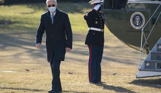 President Joe Biden arrives on the South Lawn of the White House, Monday, Feb. 8, 2021, in Washington. (AP Photo/Evan Vucci)