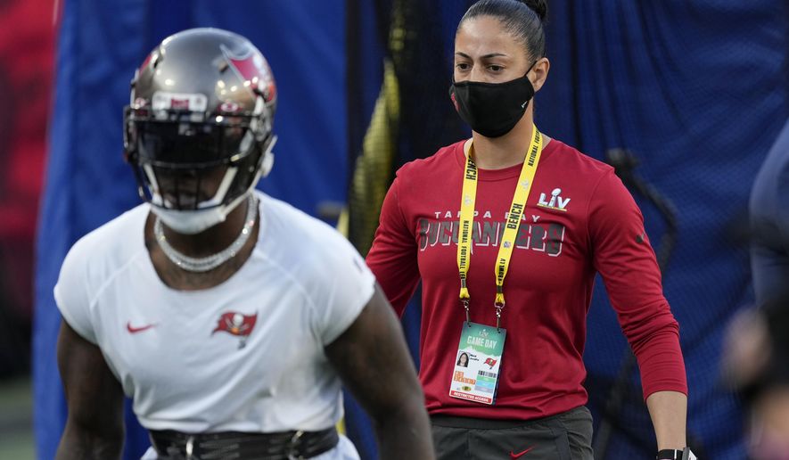 Tampa Bay Buccaneers strength and conditioning coach Maral Javadifar on the field before the NFL Super Bowl 55 football game between the Kansas City Chiefs and Buccaneers, Sunday, Feb. 7, 2021, in Tampa, Fla. (AP Photo/Chris O&#x27;Meara)