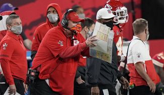 Kansas City Chiefs&#39; Andy Reid works during the first half of the NFL Super Bowl 55 football game against the Tampa Bay Buccaneers Sunday, Feb. 7, 2021, in Tampa, Fla. (AP Photo/David J. Phillip)