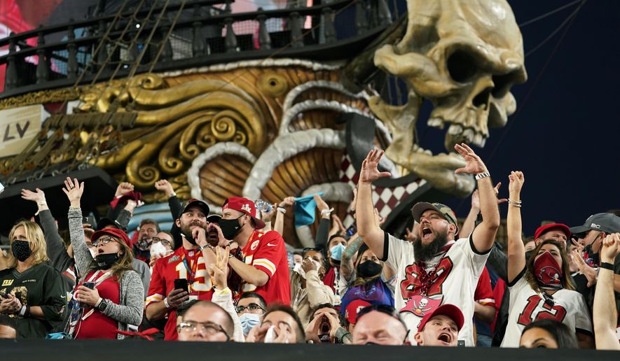Fans cheer during the first half of the NFL Super Bowl 55 football game between the Tampa Bay Buccaneers and the Kansas City Chiefs, Sunday, Feb. 7, 2021, in Tampa, Fla. (AP Photo/Mark Humphrey)