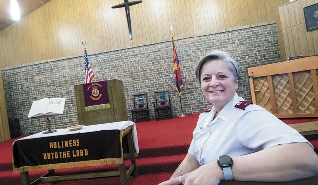 Lt. Shannon Brown, the new Corps Officer at the Hobbs Salvation Army, poses for a photo in the chapel at the Hobbs Salvation Army, Friday, Jan. 22, 2021, in Hobbs, N.M. Brown knows the struggles of homelessness and addiction. That’s one of the reasons the new corps officer for the Hobbs Salvation Army wants to turn the former Thrift Store on Main Street in Hobbs into a shelter for the area’s homeless. (Andy Brosig/The Hobbs Daily News-Sun via AP)