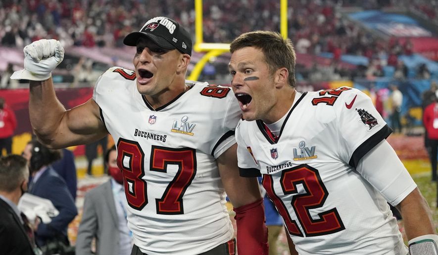 Tampa Bay Buccaneers tight end Rob Gronkowski, left, and quarterback Tom Brady celebrate after defeating the Kansas City Chiefs in the NFL Super Bowl 55 football game Sunday, Feb. 7, 2021, in Tampa, Fla. The Buccaneers defeated the Chiefs 31-9 to win the Super Bowl. (AP Photo/Ashley Landis) **FILE**