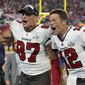 Tampa Bay Buccaneers tight end Rob Gronkowski, left, and quarterback Tom Brady celebrate after defeating the Kansas City Chiefs in the NFL Super Bowl 55 football game Sunday, Feb. 7, 2021, in Tampa, Fla. The Buccaneers defeated the Chiefs 31-9 to win the Super Bowl. (AP Photo/Ashley Landis) **FILE**