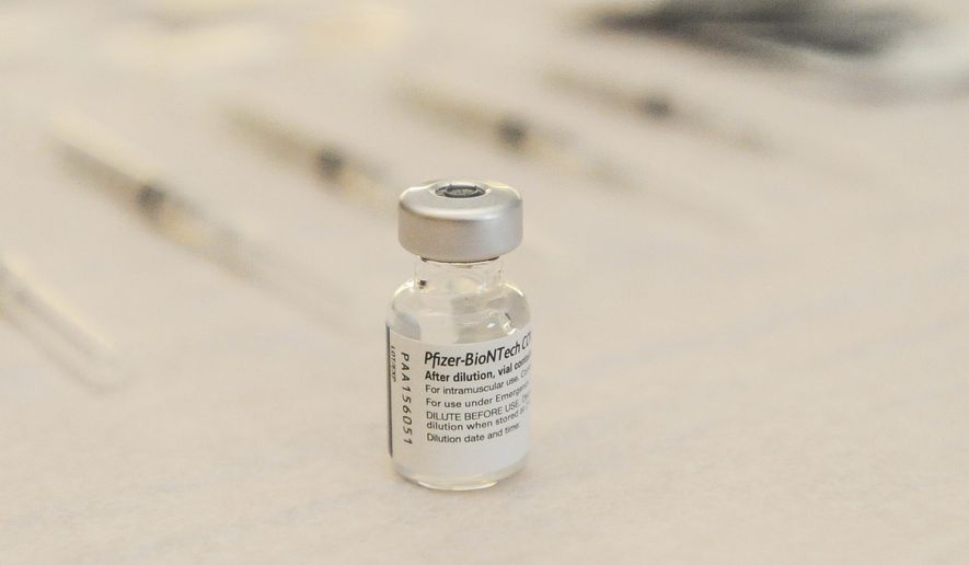 FILE - In this Dec. 14, 2020 file photo The Pfizer-BioNTech vaccine for COVID-19 is seen at Madison Memorial Hospital in Rexburg, Idaho. State and federal court judges and staffers are getting access to some of Idaho's limited doses of coronavirus vaccine even though they are not on the state's vaccine priority list. Workers with the U.S. District Courts in Boise were offered vaccinations on Monday, Feb. 8, 2021, as were some Ada County Courthouse employees. (John Roark/The Idaho Post-Register via AP, File)
