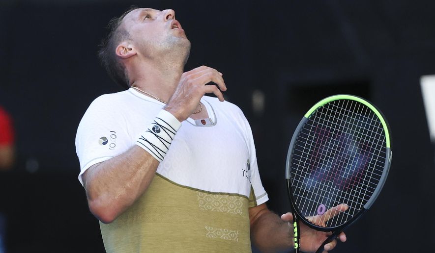 United States' Tennys Sandgren reacts during his match against Australia's Alex De Minaur during their first round match at the Australian Open tennis championship in Melbourne, Australia, Tuesday, Feb. 9, 2021.(AP Photo/Hamish Blair)