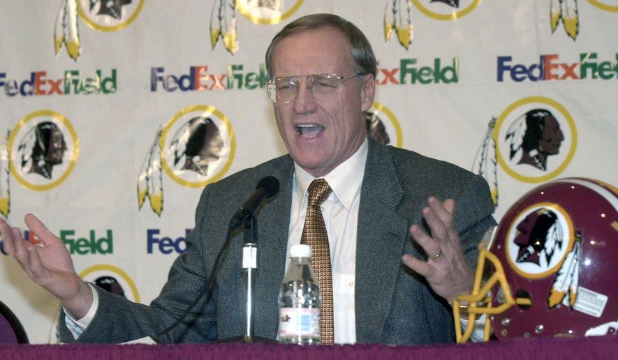 In this Jan. 4, 2001, file photo, Washington Redskin&#x27;s new head coach Marty Schottenheimer speaks at a news conference at Redskins Park in Ashburn, Va. Marty Schottenheimer, who won 200 regular-season games with four NFL teams thanks to his “Martyball” brand of smash-mouth football but regularly fell short in the playoffs, has died. He was 77.Schottenheimer died Monday night, Feb. 8, 2021,  at a hospice in Charlotte, North Carolina, his family said through Bob Moore, former Kansas City Chiefs publicist. (AP Photo/Stephen J. Boitano, FIle) **FILE**