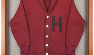 This undated photo released by RR Auction shows a Harvard University letter sweater that once belonged to former President John F. Kennedy, up for auction between Feb. 11-18, 2021, by the Boston-based auction firm. (Nikki Brickett/RR Auction via AP)