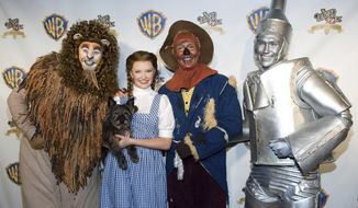 FILE - Costumed &amp;quot;Wizard of Oz&amp;quot; characters attend the &amp;quot;Wizard of Oz&amp;quot; 70th Anniversary Emerald Gala on Sept. 24, 2009, in New York. New Line Cinema is making a new adaptation of “The Wonderful Wizard of Oz,” the L. Frank Baum children’s novel, with Nicole Kassell, the visual architect of “Watchmen,” set to direct. (AP Photo/Charles Sykes, File)