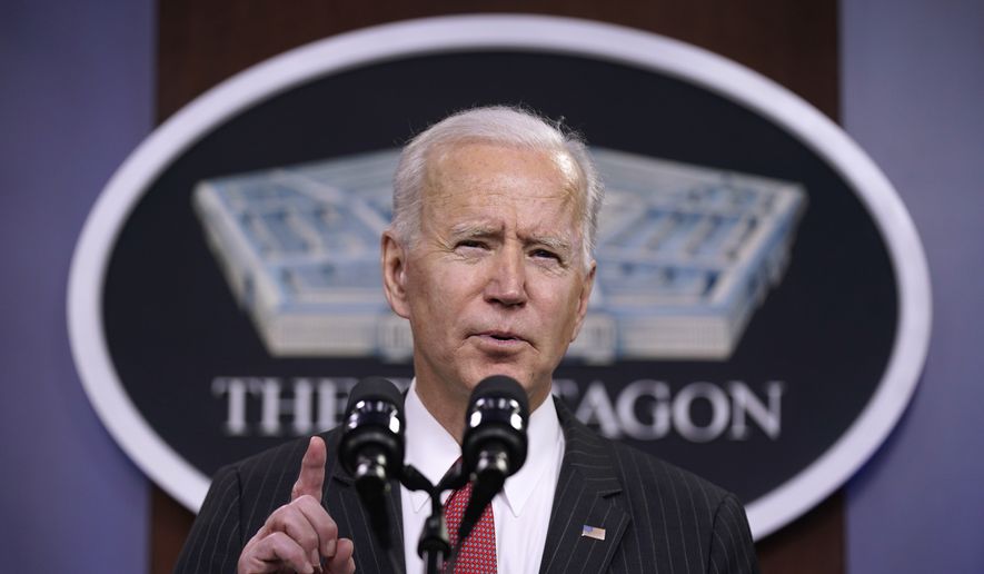 In this file photo, President Joe Biden speaks to Department of Defense personnel alongside Vice President Kamala Harris and Defense Secretary Lloyd Austin at the Pentagon, Wednesday, Feb. 10, 2021, in Washington. (AP Photo/Patrick Semansky) **FILE**