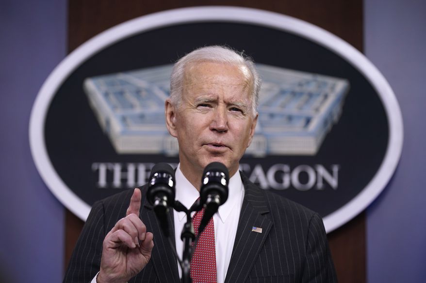 In this file photo, President Joe Biden speaks to Department of Defense personnel alongside Vice President Kamala Harris and Defense Secretary Lloyd Austin at the Pentagon, Wednesday, Feb. 10, 2021, in Washington. (AP Photo/Patrick Semansky) **FILE**