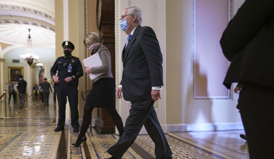 Senate Minority Leader Mitch McConnell, R-Ky., returns to the chamber for the second impeachment trial of former President Donald Trump, at the Capitol in Washington, Tuesday, Feb. 9, 2021. Trump was charged by the House with incitement of insurrection for his role in agitating a violent mob of his supporters that laid siege to the U.S. Capitol on Jan. 6, sending members of Congress into hiding as the Electoral College met to validate President Joe Biden&#39;s victory. (AP Photo/J. Scott Applewhite)