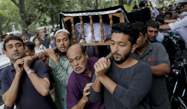 FILE- In this Nov. 1, 2015 file photo, Bangladeshi people carry the body of Faisal Arefin Deepan, a publisher of secular books, during his funeral in Dhaka, Bangladesh, . A special tribunal in Bangladesh’s capital on Wednesday sentenced to death eight Islamic militants tied to a banned group for the 2015 killing of the publisher of books on secularism and atheism. (AP Photo/ A.M. Ahad, File)