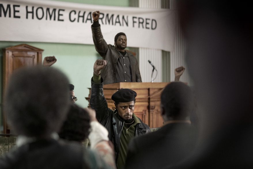 This image released by Warner Bros. Pictures shows Lakeith Stanfield, foreground center, and Daniel Kaluuya, background center, in a scene from "Judas and the Black Messiah." (Warner Bros. Pictures via AP)