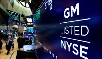 In this April 23, 2018, file photo, the logo for General Motors appears above a trading post on the floor of the New York Stock Exchange. (AP Photo/Richard Drew, File)
