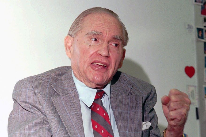 Former four-term Alabama Gov. George C. Wallace makes a rare public appearance at Dannelly Elementary School in Montgomery, Ala., in this Wednesday, May 22, 1996, file photo. The University of Alabama at Birmingham has removed the name of four-term governor and presidential candidate George C. Wallace from a campus building over his support of racial segregation. A resolution unanimously approved by trustees Friday, Feb. 5, 2021, said Wallace rose to power by defending racial separation and stoking racial animosity. (AP Photo/Dave Martin, File)