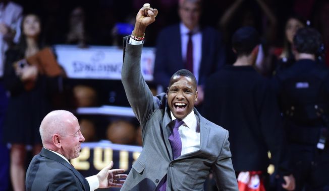 This Oct. 29, 2019,  file photo shows Toronto Raptors president Masai Ujiri reacting after receiving his 2019 NBA basketball championship ring from Larry Tanenbaum, chairman of Maple Leaf Sports &amp;amp; Entertainment, before the Raptors played the New Orleans Pelicans in Toronto. A law enforcement officer in California who sued Ujiri, the president of the Toronto Raptors over a 2019 scuffle following the team&#x27;s NBA Finals victory over the Golden State Warriors dropped his lawsuit Wednesday, Feb. 10, 2021. (Frank Gunn/The Canadian Press via AP, File) **FILE**