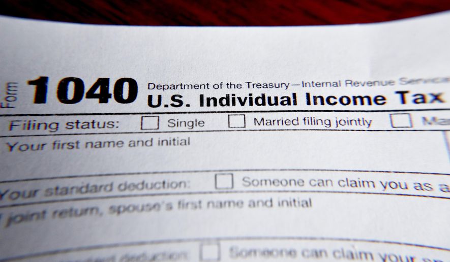 This Wednesday, Feb. 13, 2019 file photo shows part of a 1040 federal tax form printed from the Internal Revenue Service website, in Zelienople, Pa.  (AP Photo/Keith Srakocic, File)  **FILE**
