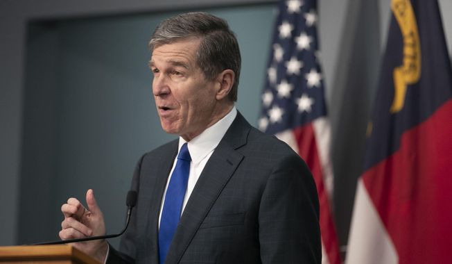 North Carolina Gov. Roy Cooper speaks during a press briefing on the COVID-19 virus and vaccination efforts on Tuesday, Feb. 9, 2021 at the Emergency Operations Center in Raleigh, N.C. (Robert Willett/The News &amp;amp; Observer via AP)