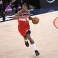 Washington Wizards guard Bradley Beal (3) dribbles the ball during the first half of an NBA basketball game against the Toronto Raptors, Wednesday, Feb. 10, 2021, in Washington. (AP Photo/Nick Wass)