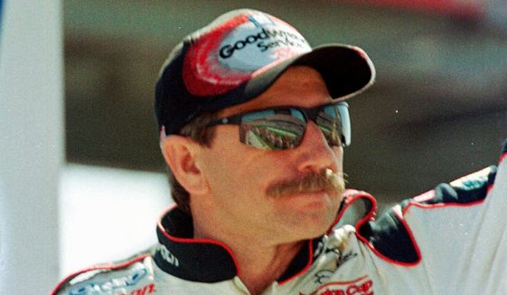 In this Feb. 18, 2001, file photo, Dale Earnhardt waves to fans during race introduction before the start of the Daytona 500 auto race at the Daytona International Speedway in Daytona Beach, Fla. Earnhardt, the greatest stock car star of his era, was killed in a crash on the last turn of the last lap of the race that day as he tried to protect Michael Waltrip&#39;s victory (AP Photo/Russell Williams, File) **FILE**