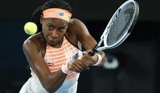 United States&#39; Coco Gauff makes a backhand return to Ukraine&#39;s Elina Svitolina during their second round match at the Australian Open tennis championship in Melbourne, Australia, Thursday, Feb. 11, 2021.(AP Photo/Rick Rycroft))