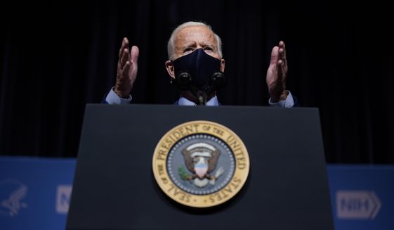 President Joe Biden speaks during a visit to the Viral Pathogenesis Laboratory at the National Institutes of Health, Thursday, Feb. 11, 2021, in Bethesda, Md. (AP Photo/Evan Vucci)