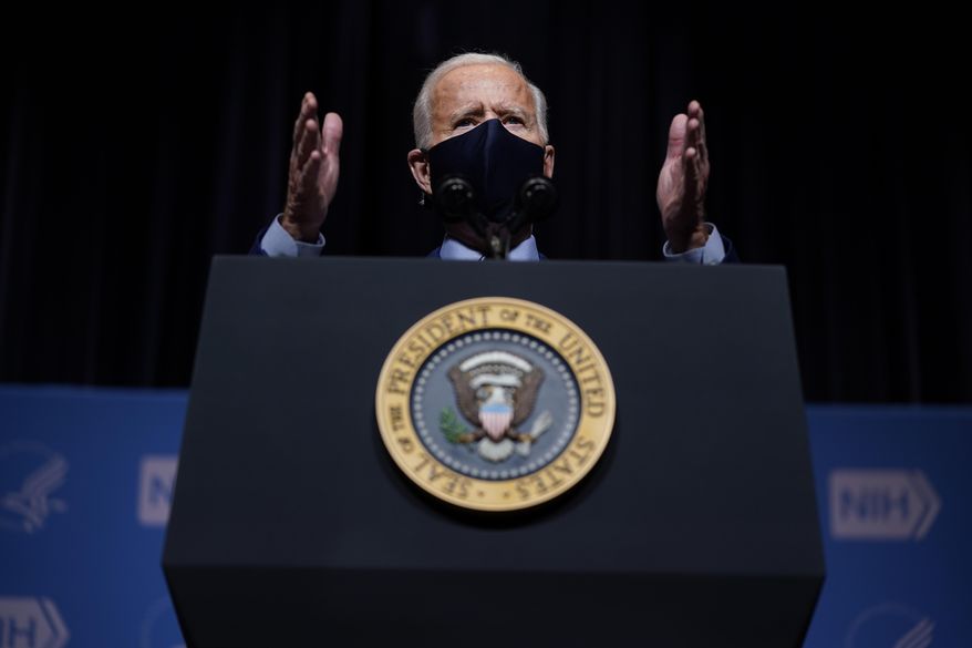 President Joe Biden speaks during a visit to the Viral Pathogenesis Laboratory at the National Institutes of Health, Thursday, Feb. 11, 2021, in Bethesda, Md. (AP Photo/Evan Vucci)