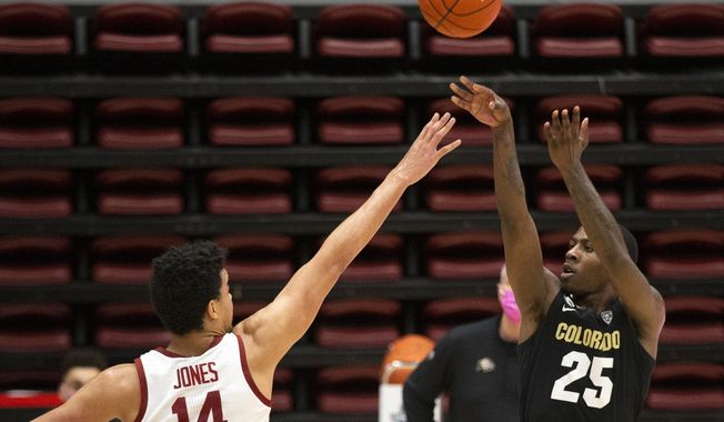 Colorado guard McKinley Wright IV (25) shoots over Stanford forward Spencer Jones (14) during the second half of an NCAA college basketball game, Thursday, Feb. 11, 2021, in Stanford, Calif. Colorado won 69-51. (AP Photo/D. Ross Cameron)