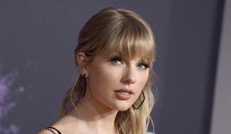 This Nov. 24, 2019, file photo shows Taylor Swift at the American Music Awards in Los Angeles. Swift announced online that she’s dropping the first of her re-recorded albums. She said “Fearless: Taylor’s Version” features re-recorded songs from her sophomore album, “Fearless.” The new set will also contain six never-before-released songs. Swift will also release a new version of her song “Love Story” from “Fearless” on Thursday at midnight. (Photo by Jordan Strauss/Invision/AP, File)