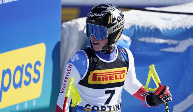 Switzerland&#x27;s Lara Gut-Behrami reactss as she arrives at the finish area during the women&#x27;s super-G, at the alpine ski World Championships in Cortina d&#x27;Ampezzo, Italy, Thursday, Feb. 11, 2021. (AP Photo/Giovanni Auletta)