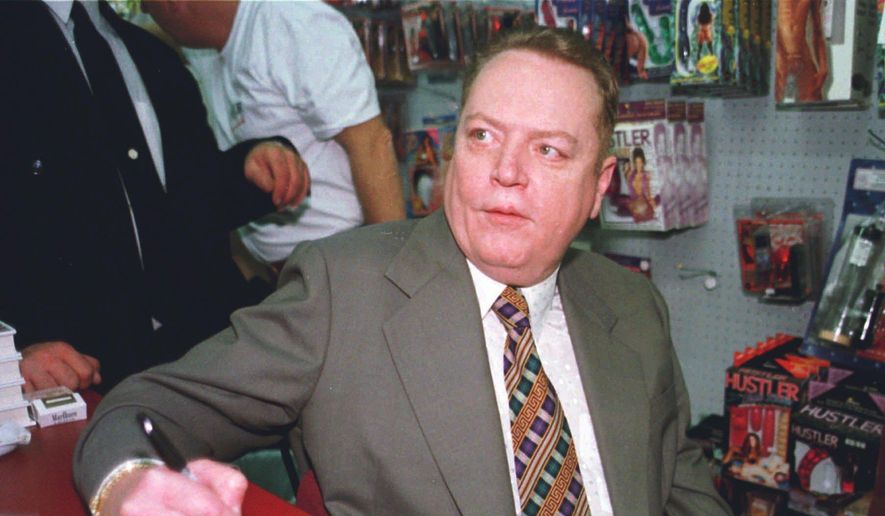 &amp;quot;Hustler&amp;quot; Magazine publisher Larry Flynt signs a copy of &amp;quot;The People Vs. Larry Flynt&amp;quot; in his downtown Cincinnati &amp;quot;Hustler&amp;quot; store on April 30, 1998. Flynt, who turned &amp;quot;Hustler&amp;quot; magazine into an adult entertainment empire while championing First Amendment rights, has died at age 78. His nephew, Jimmy Flynt Jr., told The Associated Press that Flynt died Wednesday, Feb. 10, 2021, of heart failure at his Hollywood Hills home in Los Angeles. (AP Photo/Tom Uhlman, File)