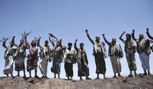 In this Sept. 22, 2014 file photo, Hawthi Shiite rebels chant slogans at the compound of the army&#x27;s First Armored Division, after they took it over, in Sanaa, Yemen.  Yemen’s war began in September 2014, when the Houthis seized the capital Sanaa. Saudi Arabia, along with the United Arab Emirates and other countries, entered the war alongside Yemen’s internationally recognized government in March 2015. The war has killed some 130,000 people and driven the Arab world’s poorest country to the brink of famine.   (AP Photo/Hani Mohammed, File)  **FILE**