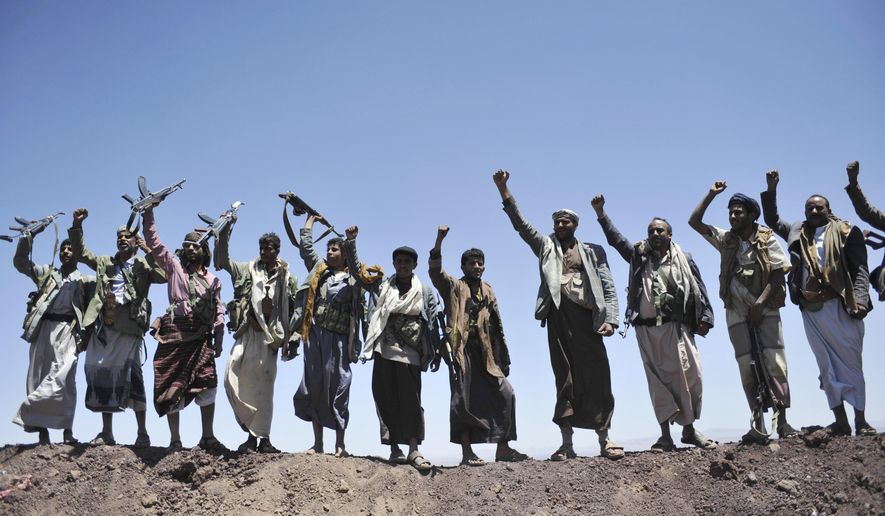 In this Sept. 22, 2014 file photo, Hawthi Shiite rebels chant slogans at the compound of the army&#39;s First Armored Division, after they took it over, in Sanaa, Yemen.  Yemen’s war began in September 2014, when the Houthis seized the capital Sanaa. Saudi Arabia, along with the United Arab Emirates and other countries, entered the war alongside Yemen’s internationally recognized government in March 2015. The war has killed some 130,000 people and driven the Arab world’s poorest country to the brink of famine.   (AP Photo/Hani Mohammed, File)  **FILE**