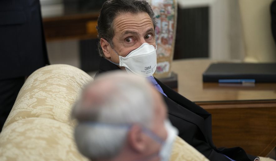 Gov. Andrew Cuomo, D-N.Y., listens to a question during a meeting between President Joe Biden and a bipartisan group of mayors and governors to discuss a coronavirus relief package, in the Oval Office of the White House, Friday, Feb. 12, 2021, in Washington. (AP Photo/Evan Vucci)