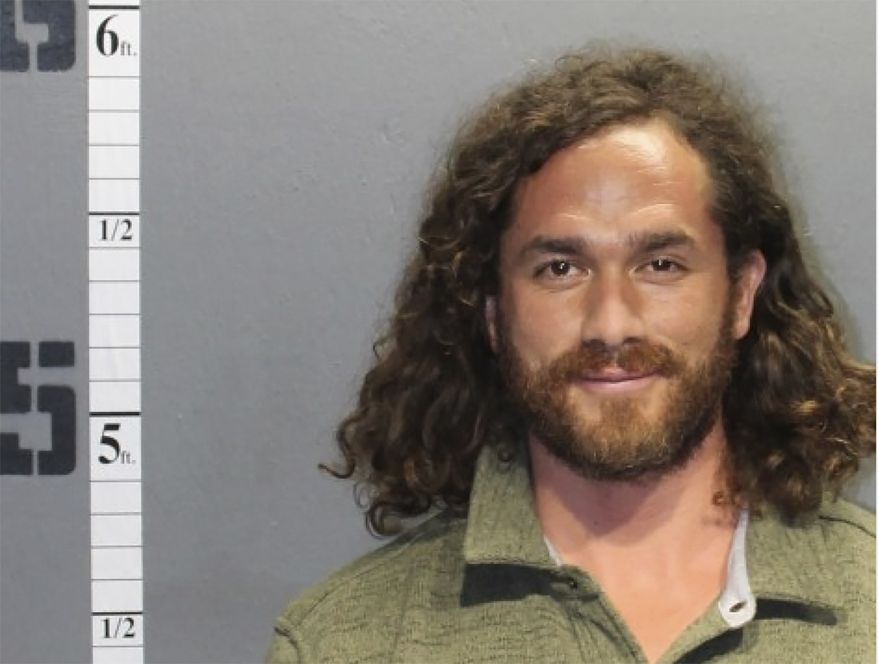 This booking photo provided by Western Tidewater Regional Jail shows Eduardo Nicolas Alvear Gonzalez. Authorities say Gonzalez is seen wearing American flag pants and allegedly smoking marijuana during the U.S. Capitol riot was arrested in Virginia. Gonzalez is scheduled for a remote hearing Friday, Feb. 12, 2021 in U.S. District Court in Norfolk. He faces several charges related to his alleged participation at the insurrection on Jan. 6. (Western Tidewater Regional Jail via AP)