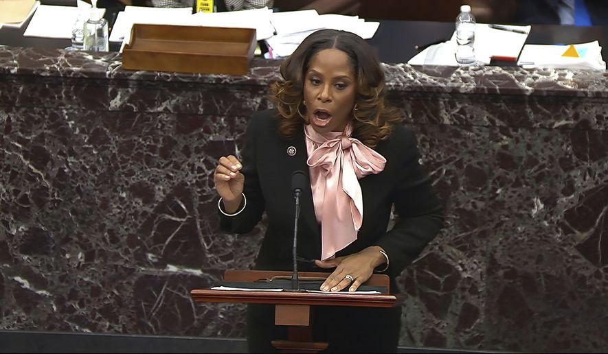 In this image from video, House impeachment manager Del. Stacey Plaskett, D-Virgin Islands, answers a question from Sen. Ron Johnson, R-Wis., during the second impeachment trial of former President Donald Trump in the Senate at the U.S. Capitol in Washington, Friday, Feb. 12, 2021. (Senate Television via AP)