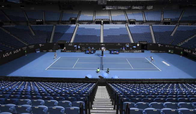 Karolina Muchova of the Czech Republic and compatriot Karolina Pliskova play in an empty Rod Laver Arena during their third round match at the Australian Open tennis championship in Melbourne, Australia, Saturday, Feb. 13, 2021. The Australian Open continues but without crowds after the Victoria state government imposed a five-day lockdown starting Saturday in response to a COVID-19 outbreak at a quarantine hotel.(AP Photo/Andy Brownbill)