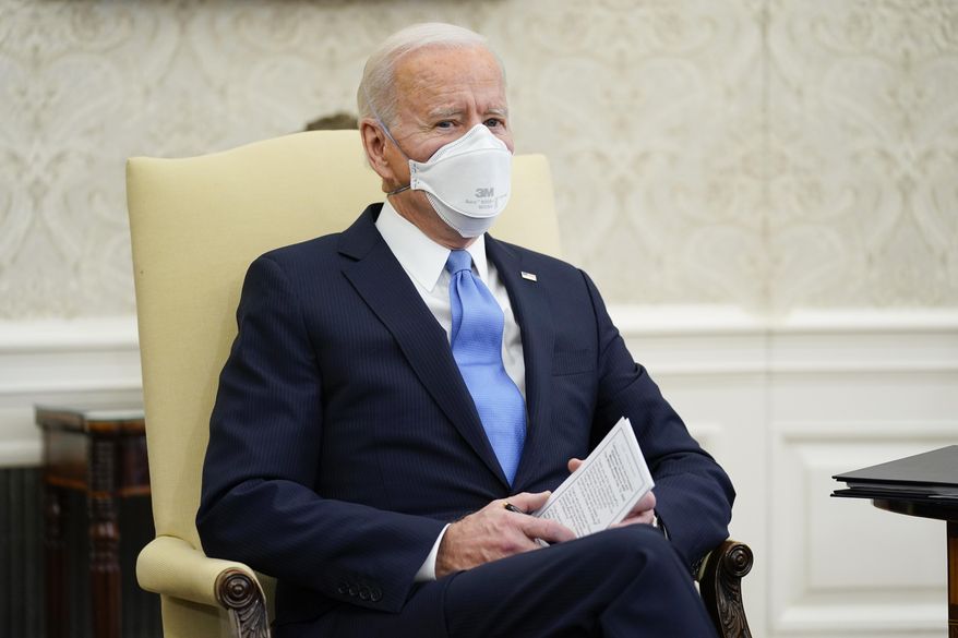 President Joe Biden speaks during a meeting with a bipartisan group of mayors and governors to discuss a coronavirus relief package, in the Oval Office of the White House, Friday, Feb. 12, 2021, in Washington. (AP Photo/Evan Vucci)