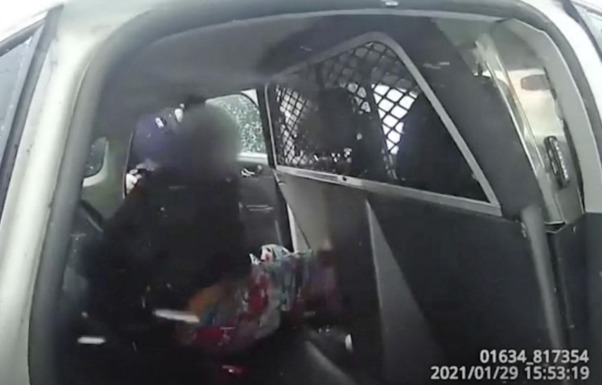 FILE - In this Jan. 29. 2021 frame from a Rochester Police Department body-camera video, a 9-year-old Black girl is handcuffed in custody in a cruiser after police used pepper spray on her as she screamed for her father. The case has spurred outrage as the latest example of law enforcement mistreatment of Black people, and one that shows even Black children are not exempt. (Rochester Police Department via AP, File)