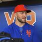 In this May 16, 2019 file photo, Syracuse Mets&#39; Tim Tebow speaks with reporters prior to a minor league baseball game in Syracuse, N.Y.  Tebow has been invited to big league spring training by the New York Mets, taking one of 75 spots after Major League Baseball limited spring roster sizes as a coronavirus precaution.   (AP Photo/John Kekis, File)