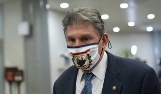 Sen. Joe Manchin, D-W.Va., departs on Capitol Hill in Washington, Saturday, Feb. 13, 2021, after the Senate acquitted former President Donald Trump in his second impeachment trial in the Senate. Trump was accused of inciting the Jan. 6 attack on the U.S. Capitol, and the acquittal gives him a historic second victory in the court of impeachment. (AP Photo/Alex Brandon)