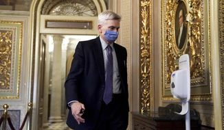 Sen. Bill Cassidy, R-La., walks on Capitol Hill after the Senate acquitted former President Donald Trump in his second impeachment trial in the Senate at the U.S. Capitol in Washington, Saturday, Feb. 13, 2021. Trump was accused of inciting the Jan. 6 attack on the U.S. Capitol, and the acquittal gives him a historic second victory in the court of impeachment. (Greg Nash/Pool via AP)