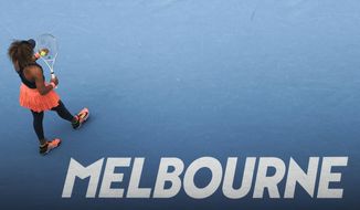 Japan&#39;s Naomi Osaka prepares to serve to Spain&#39;s Garbine Muguruza during their fourth round match at the Australian Open tennis championship in Melbourne, Australia, Sunday, Feb. 14, 2021.(AP Photo/Hamish Blair)