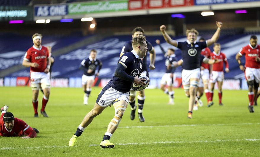 Scotland's Darcy Graham runs in to score his side's first try, during the Six Nations rugby union international match between Scotland and Wales, at BT Murrayfield Stadium, in Edinburgh, Scotland, Saturday, Feb. 13, 2021. (Jane Barlow/PA via AP)
